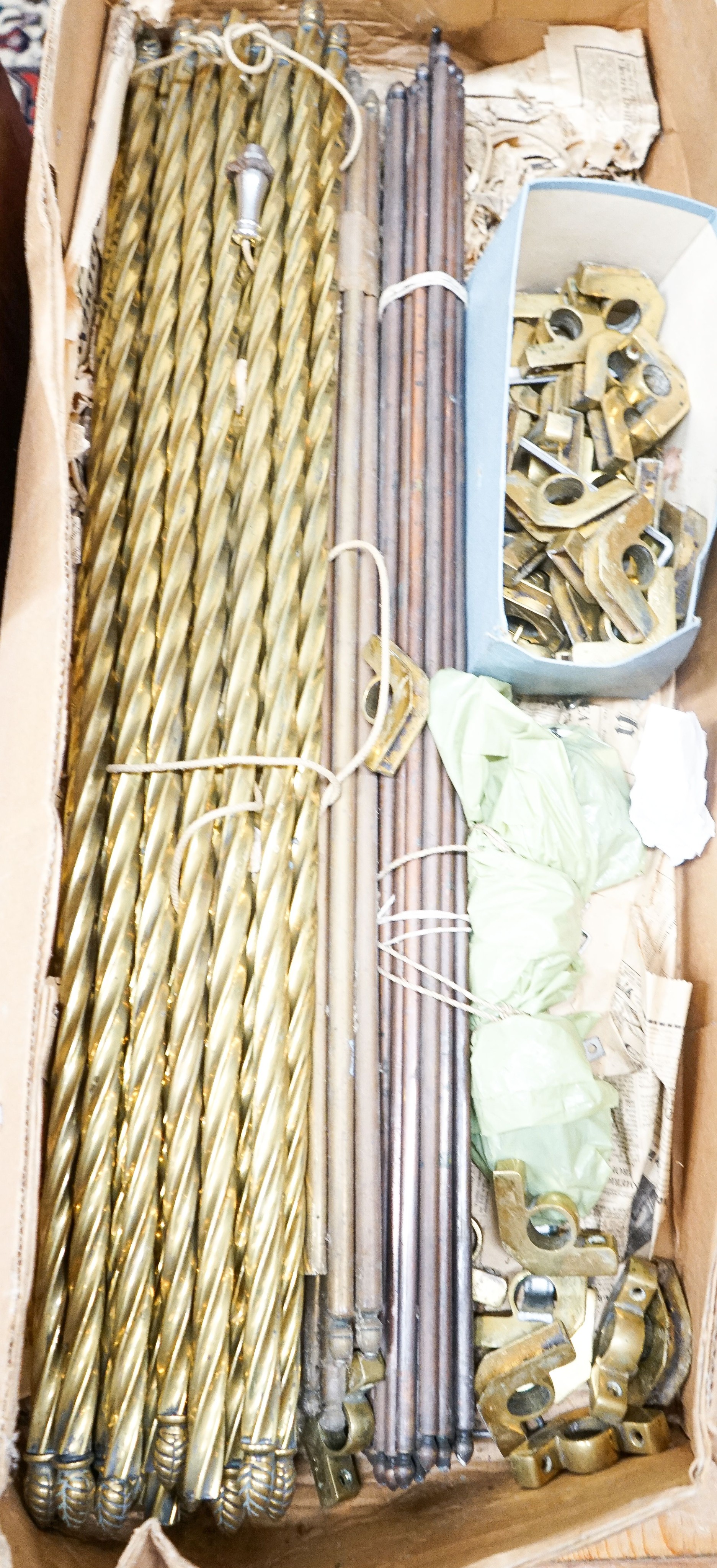 A quantity of Victorian brass and copper stair rods with fittings